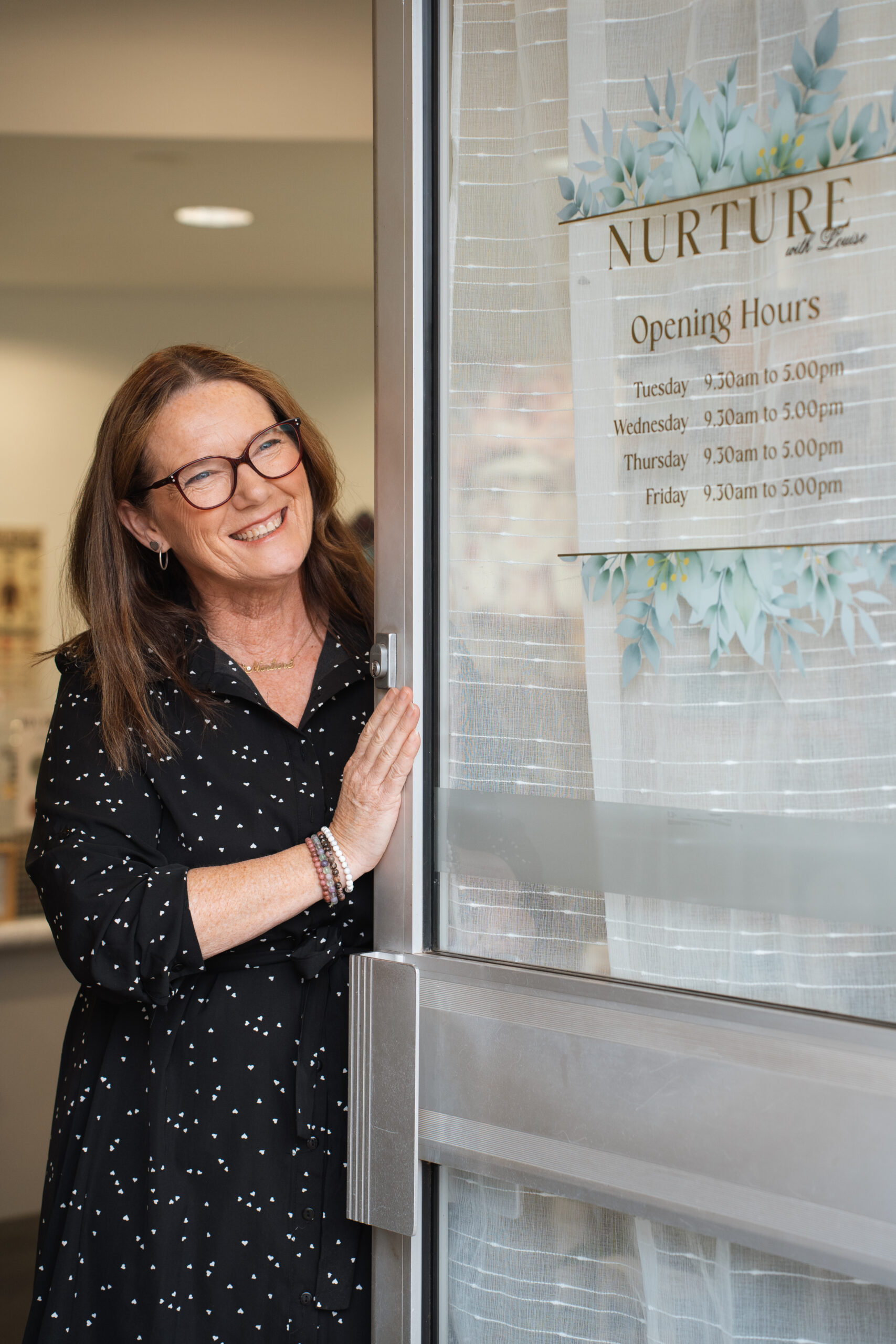 Naturopath Louise Mace smiling at the entrance of her Deniliquin clinic.